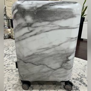 Calpak marble carry on suitcase